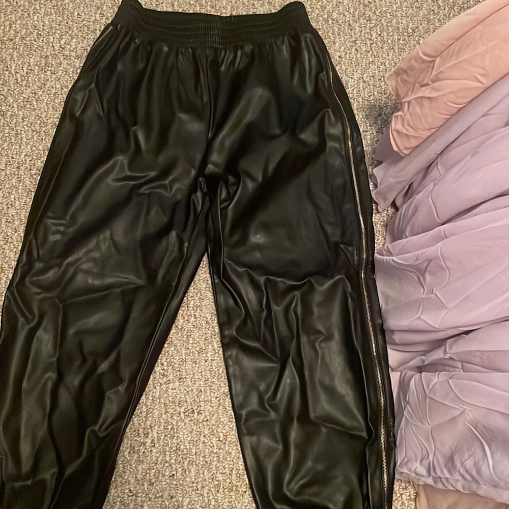 Leather pants with side zippers.